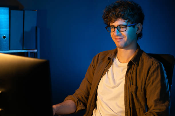 istock Young businessman reading design thinking on paper for new project. Gusher. 2032457981