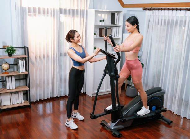istock Energetic and strong athletic asian woman running on machine. Vigorous 2032462982