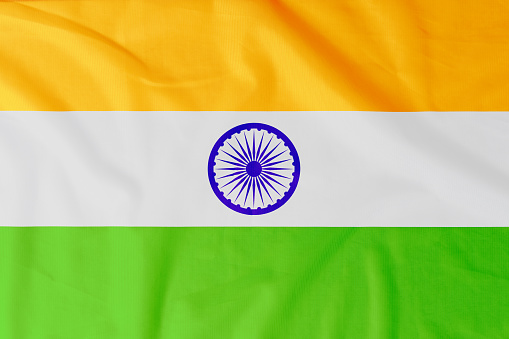 Flag of Republic of India with natural material creases as a background