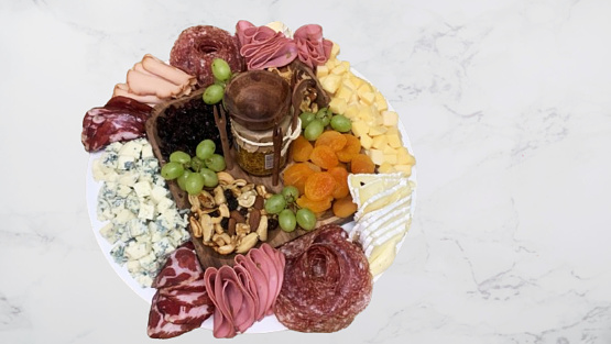 Appetizer, antipasto with cold cuts, fruits