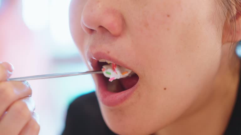 Adult female eating Ice cream sundae