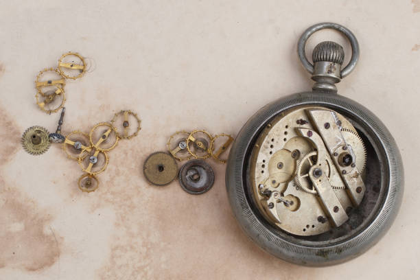 istock broken vintage pocket watch on dirty paper 2032484190