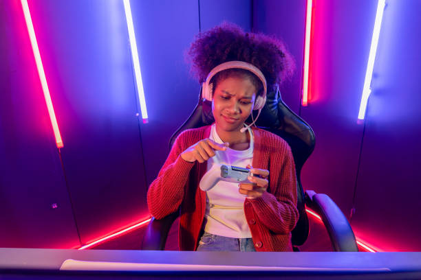 istock Host channel streamer, African girl winning with Esport team. Tastemaker. 2032492014