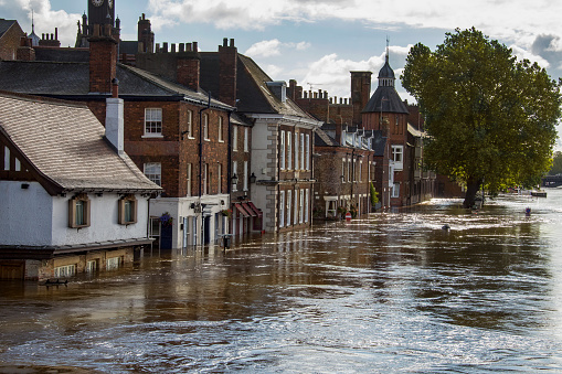 Flooded terrace houses in the town of Shrewsbury, as River Seven bursts it’s banks and overflows into streets and houses, an indication of climate change and Global warming having a very personal and damaging effect on homeowners.