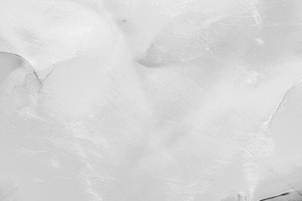 istock Light gray metal texture with deep scratches and stains, creating a rough visual effect 2032548531