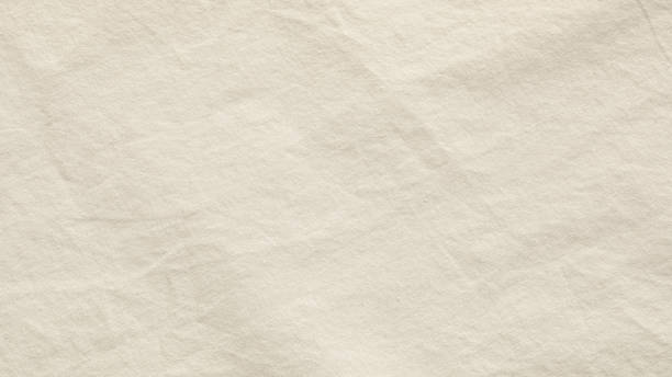 istock Close-Up View of a Textured White Canvas Fabric Surface Under Soft Lighting 2032552332