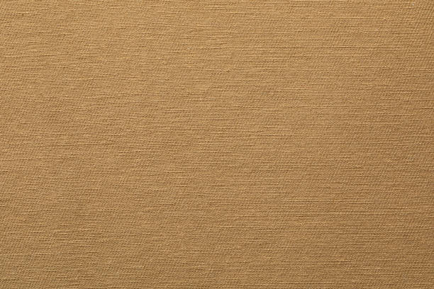 Beige Textured Fabric Close-Up Showcasing Detailed Weave Pattern and Material Quality Close-up view highlighting the texture and intricate weave of a beige fabric. linen flax textile burlap stock pictures, royalty-free photos & images