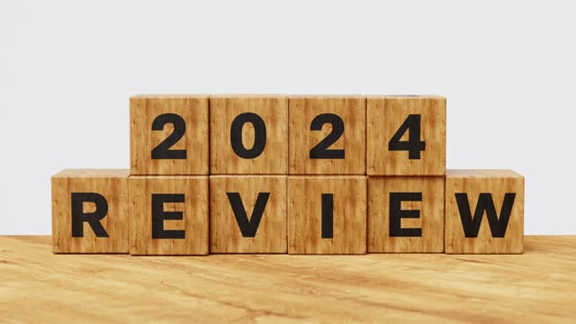 2023 and 2024 Annual review, business and customer review. Learning, improvement, planning and development concept. Wooden cubes flips from 2023 Review to 2024 Review. 4k 3d animation
