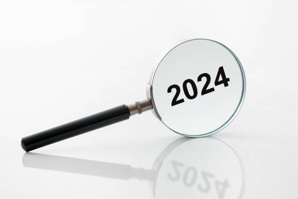 istock Black magnifying glass shows the year 2024 2032578606