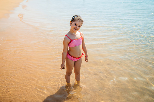 Portrait of a beautiful little girl on the beach in Hurghada in Egypt.