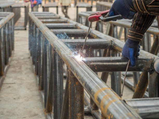 istock Arc welding for metal trusses for factory construction. 2032580214