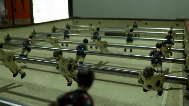 Worn table football figures in action