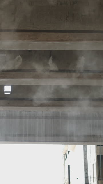 In a building of Thailand some steam is coming out