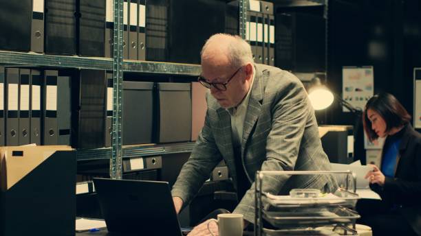 istock Senior private agent working on criminal report with classified data 2032620402