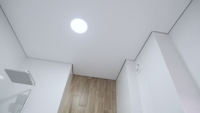 White stretch ceiling in a stylish bright bathroom. Modern design