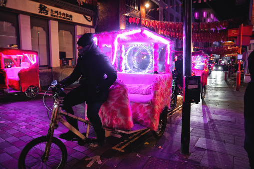 Shaftesbury Avenue in Soho, West End London Westminster United Kingdom. 11th November 2023. A Rickshaw on Macclesfield Street In Soho near Covent Garden Piazza at Night London.