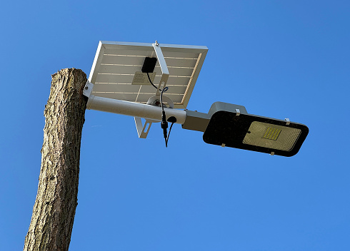 Street light powered by solar panel on the top