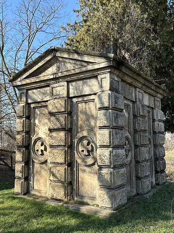 Old stone crypt in the old abandoned cemetery