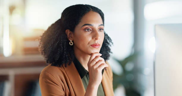 istock Girl at computer in office, thinking and reading email report, feedback review or article at digital agency. Internet, research and woman at tech startup networking, writing schedule or admin project 2032640397