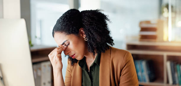 istock Business woman, headache and stress on computer for Human Resources fail, mistake or payroll error online. Professional african person or HR worker with glasses, pain or sad on desktop for bad news 2032640404