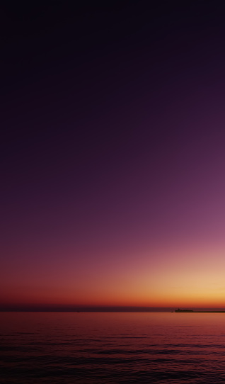 Sunset Sky Background,Beautiful Nature Landscape Summer Sun dawn in Purple,Orange,Pink,Yellow,Twilight sky in the Evening by Sea beach,Romantic Sunrise Sky in Spring, Vertical Dusk sky with sea wave