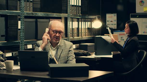 istock Private investigator requesting crucial information on landline phone call 2032649259
