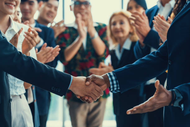 istock Cropped image of smart businessmen shaking hand, making agreement. Intellectual. 2032670565