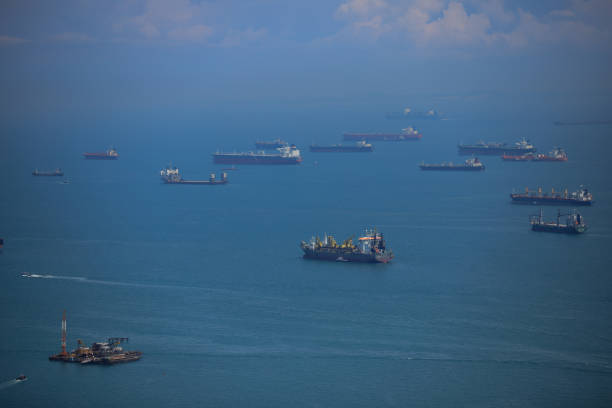 istock waiting cargo ships and tanker in front of Singapore harbour 2032689747