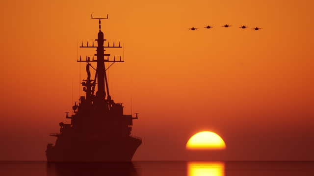 Sunset light warships uss and F35