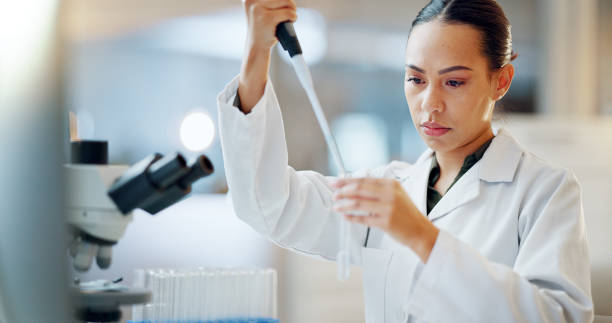 istock Science, results and woman with pipette, test tube and microscope for biotech solution in laboratory. Medical research, scientist or lab technician in study for healthcare, medicine or vaccine test. 2032712535