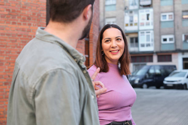 istock Colleagues talking while walking along the city 2032717858