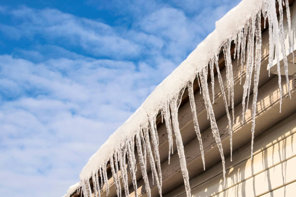 istock Icicles on the roof eaves 2032763451