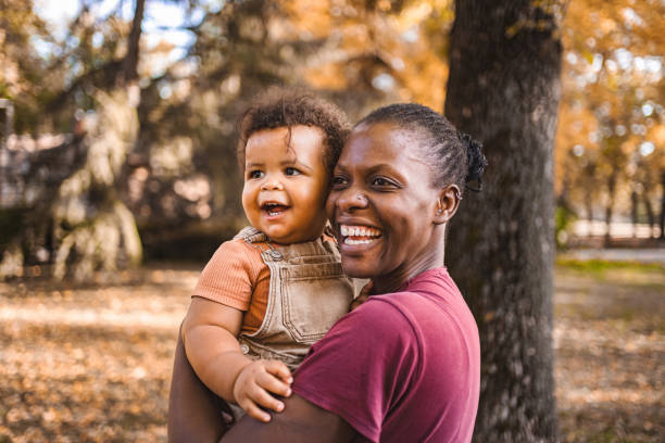 istock Mother's Embrace: Joyful Moments in the Park 2032781942