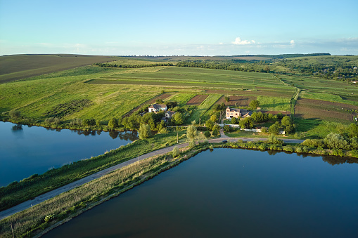 Aerial view of fish hetching pond with blue water in aquacultural area.