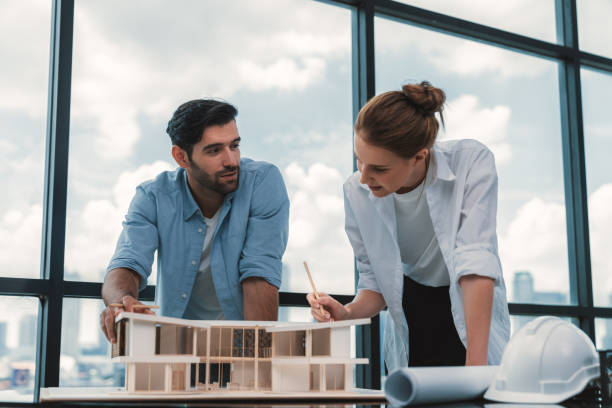istock Smart architect engineer team working together to measure house model. Tracery. 2032788954
