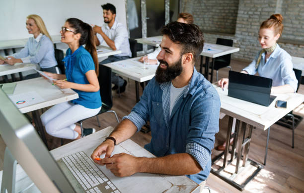 istock Successful happy group of people learning software engineering and business during presentation 2032797775