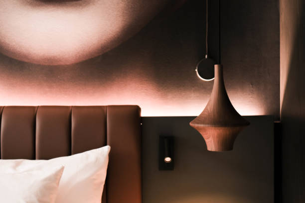 istock Modern Hotel Room Interior With Artistic Wall Decor and Pendant Light 2032843398