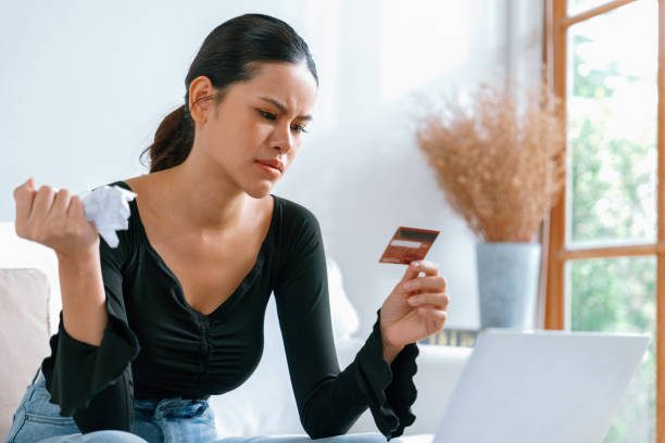 istock Stressed young woman has financial problems credit card debt to pay uttermost 2032843414