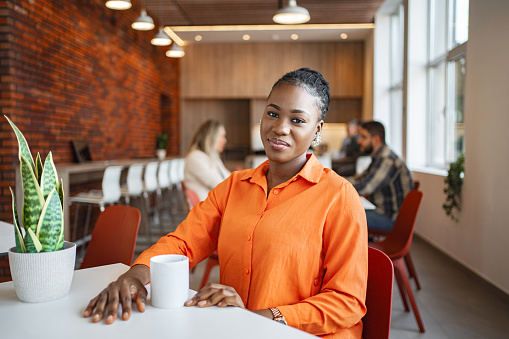 Black businesswoman on a coffee break at the office