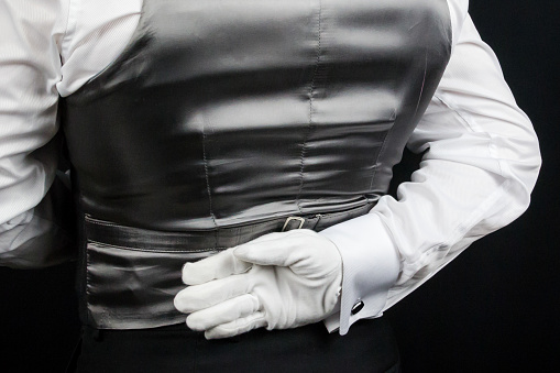 Butler in White Gloves and Waistcoat At Your Service