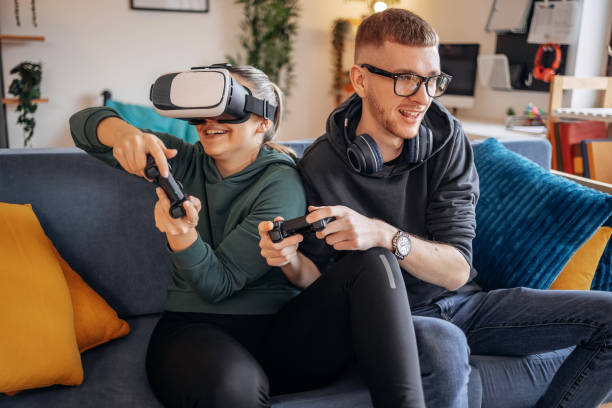 istock Couple having fun with playing video games at home 2032865219