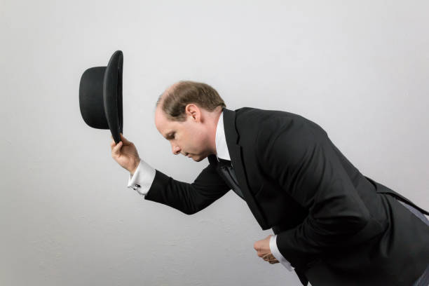 English Gentleman Doffing Bowler Hat and Bowing