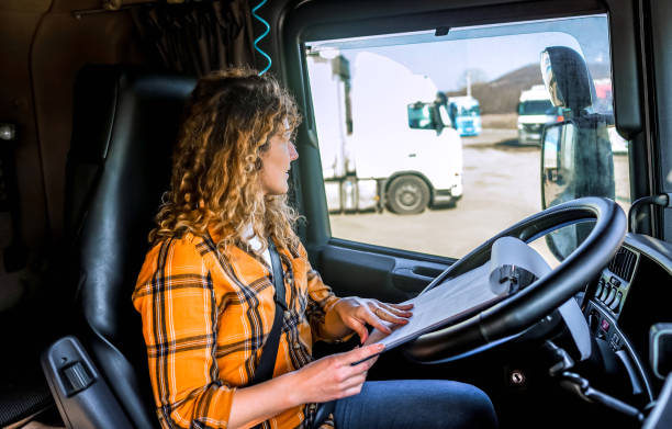 istock Female truck driver checking the delivery list 2032871069