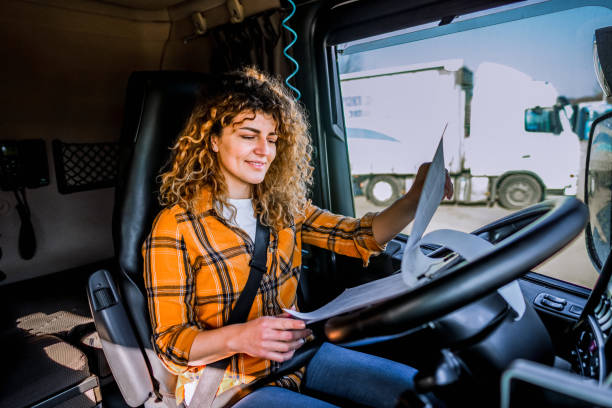 istock Female truck driver checking the delivery list 2032873164