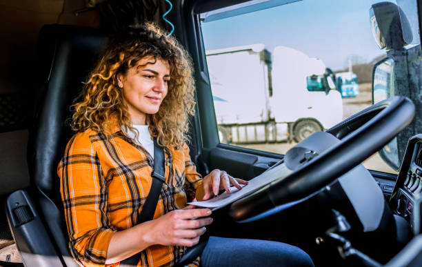 istock Female truck driver checking the delivery list 2032877328