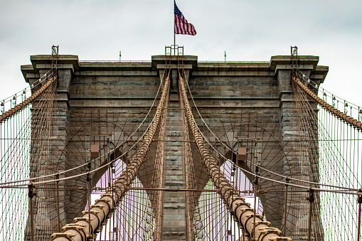 Panoramic view of the incredible Brooklyn Suspension Bridge linking the boroughs of Manhattan and Brooklyn in New York City (USA), the largest suspension bridge in the world until 1889.