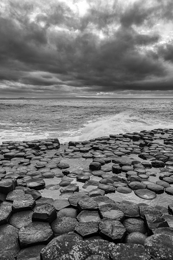 Basalt rocks and a rough sea at the Giants Causeway in Northern Ireland on a windy day