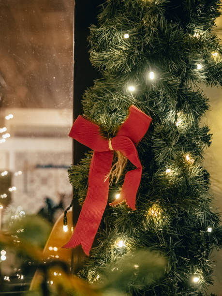 istock Lights on Christmas decorations on a city street 2032901376