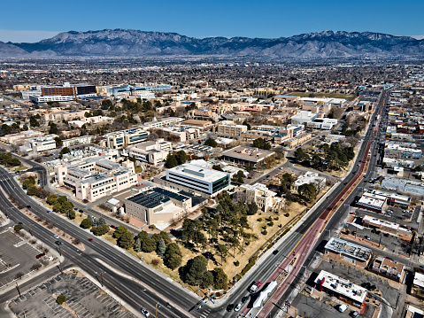 UNM Campus and Sandia Mountains showing along Central Ave