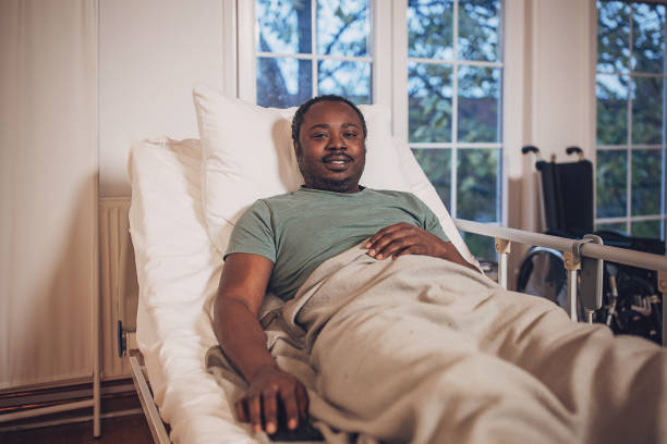 istock Man relaxing in hospital bed 2032940240